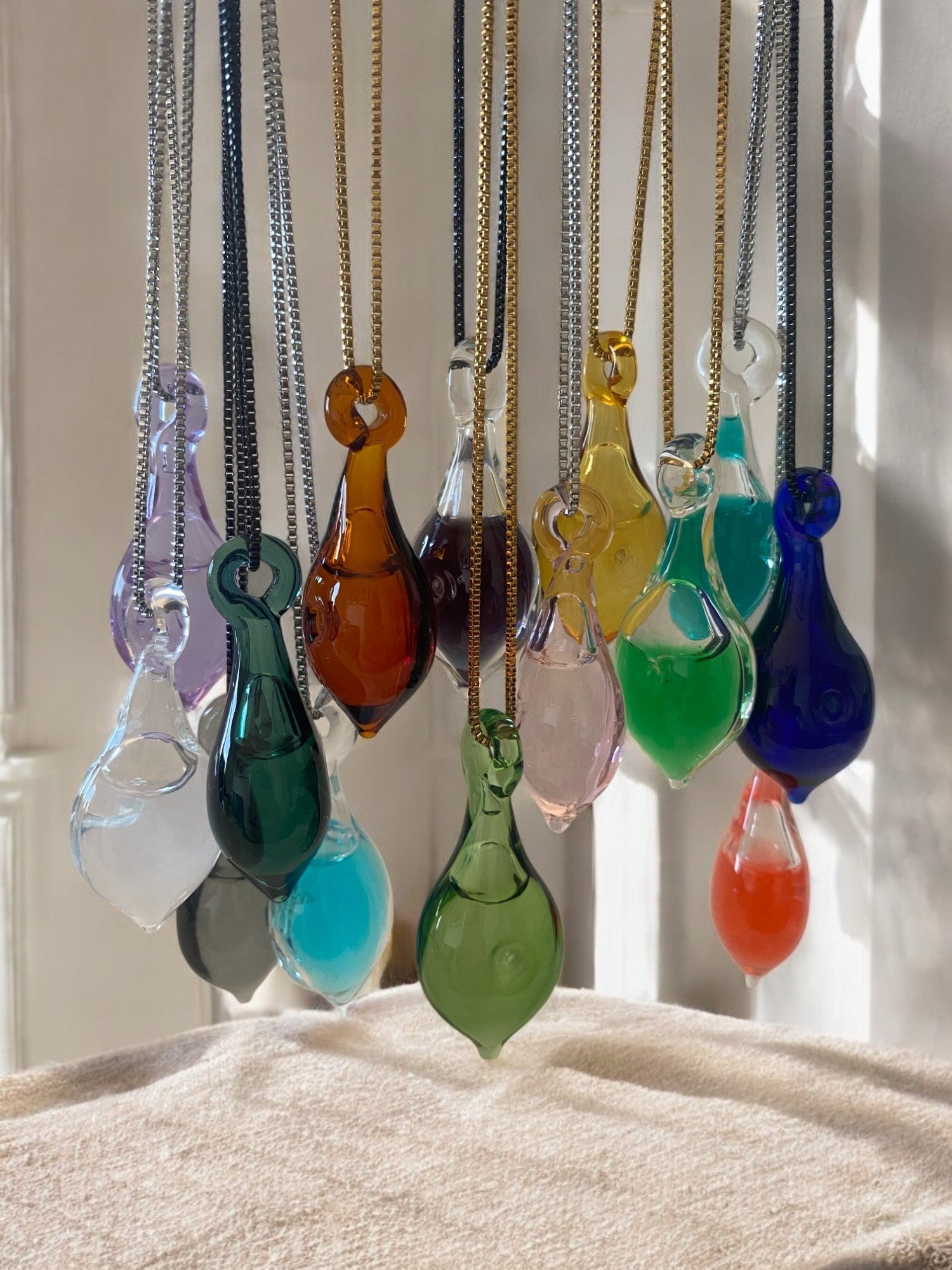 Essence Filled Glass Pendant Collection